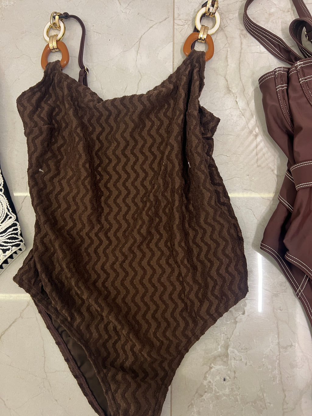 Brown swimsuit with accessories