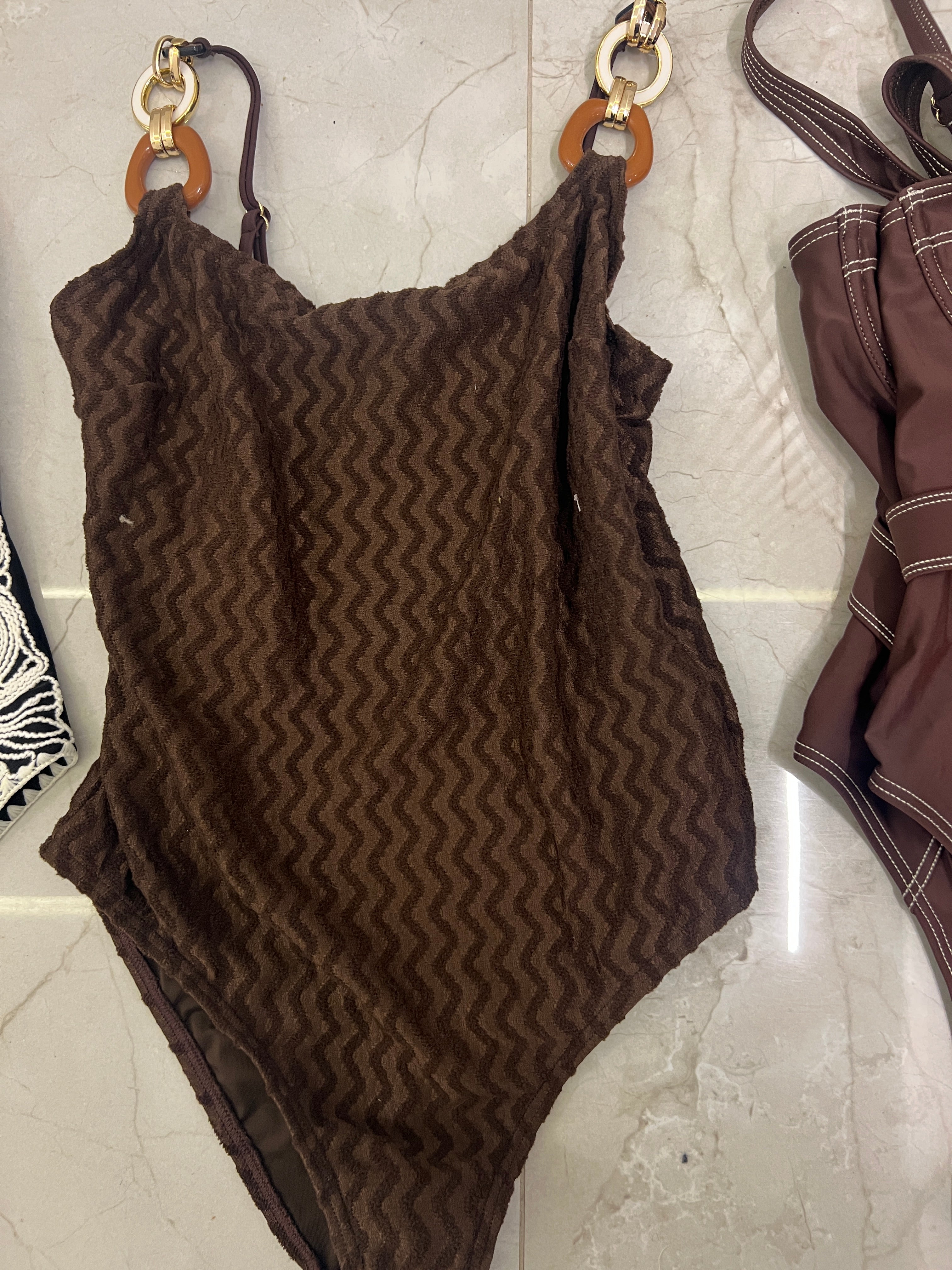 Brown swimsuit with accessories